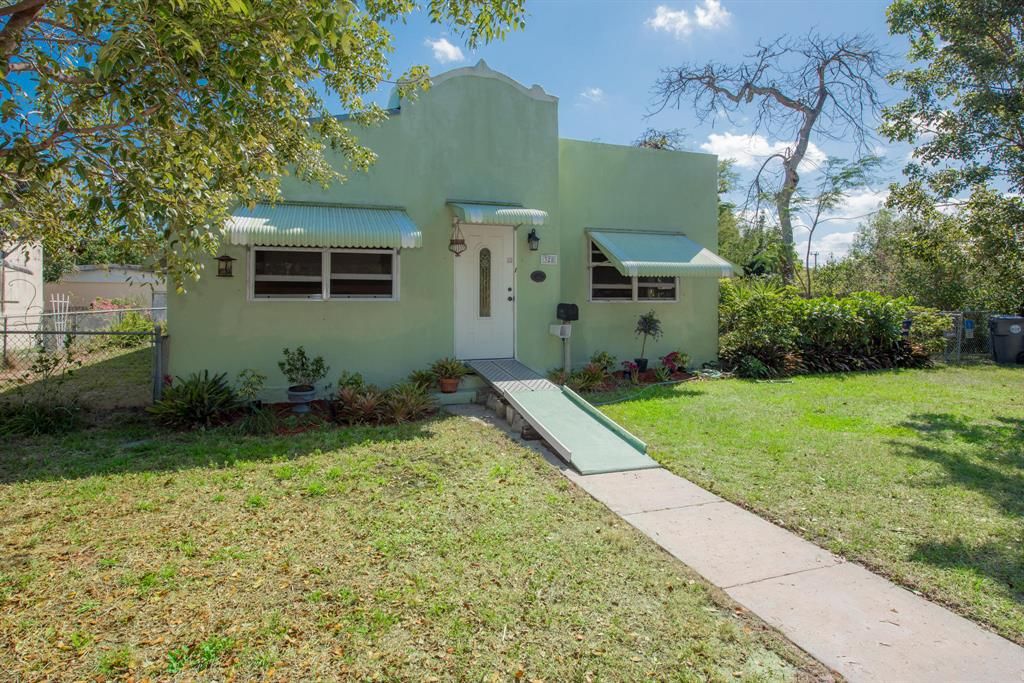 Photo of 328 Hawthorne Drive, Lake Park, FL 33403 (MLS # R10700594)