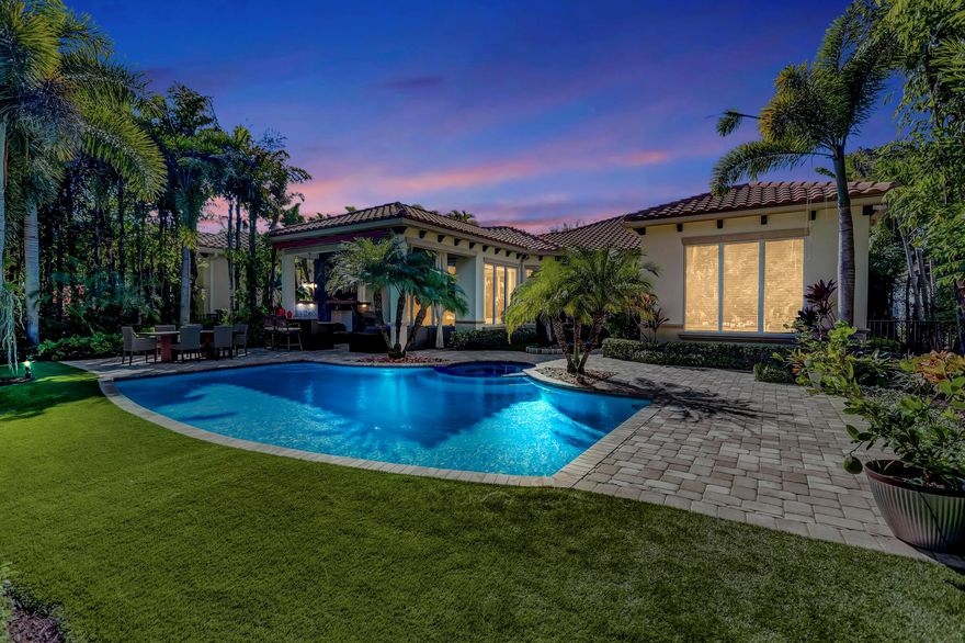 Masterfully designed, this exquisite pool home boasts the perfect combination of a private retreat, yet generous space for both inside and outdoor entertaining. Recently renovated with impeccable craftsmanship, this stunning home is nestled on one of the largest GOLF ESTATE lots within the prestigious community of OLD PALM GOLF CLUB.  Offering first class concierge service and resort style living, this rarely available MARTINIQUE floor plan, (custom built by Mustapick), offers formal and informal settings to create a living experience that embodies modern luxuries with casual living. 
This spectacular residence, built in 2012, features 3 bedrooms PLUS custom-built office/den, 3.5 baths, 2.5 car garage, nearly 3,400 SF under air with heated pool/spa and magnificent backyard. Impressive upon entry, this inviting home is adorned with double tray and crown ceilings, stunning marble tile floors in main living areas. Elegant entryway leads to formal dining and living rooms, new wet bar with wine refrigerator and custom cabinetry, and perfectly designed draperies throughout. Incredible gourmet kitchen perfectly equipped with custom cabinets and crown molding, under cabinet lighting, new oversized LG refrigerator, 5-Burner gas cooktop, expansive kitchen island with granite counter tops and sparkling pendant lighting. Spacious breakfast area off the kitchen leads to family room with custom built entertainment wall, all surrounded by hues of natural light. Newly designed and extended office/den, features classic double glass doors, custom built-ins, and LED lighting. Separate laundry room with granite counters, ample cabinets and new Front Load Washer and Dryer.
Grand master suite, nestled in its own private wing, with sparkling pool views, plush new carpet, and custom built-ins in both his & her closets. Luxurious master bath has stunning marble floors and counter tops, dual sinks, expanded vanities with modern lighting, designer finishes and custom draperies, separate jacuzzi tub and oversized shower with frameless glass and decorative tile. Both family members and guests will love the 2 generous bedrooms and guest bath completely remodeled with spa-inspired design, frameless glass shower, custom vanity, and mirror. Bask in your private outdoor paradise! This home raises outdoor living to a new level of beauty + enjoyment! This magnificent backyard is complete with radiant pool/spa with new equipment and SMART phone controls. Picturesque spa wall custom-built and elegantly designed with tranquil fountain and decorative rocks. Oversized covered patio with incredible detailed Pecky Cypress ceiling, LED lights, built-in grill and full summer kitchen, with magnificent fireplace encased in marble. Tropical lush landscaping throughout with new exterior lighting in both front and back yards. This exclusive and unique lot backs to enormous preserve land with winding water feature. A beautiful lifestyle awaits you...
Form meets highest end function in every detail including updated security system and SMART doorbell, new safe installation, new shutters, new TV's and Sonos surround sound, and termite system.  The owners took great pride in creating this majestic Golf Estate. From the finest details to the impeccable finishes - this stunning home will leave you speechless.