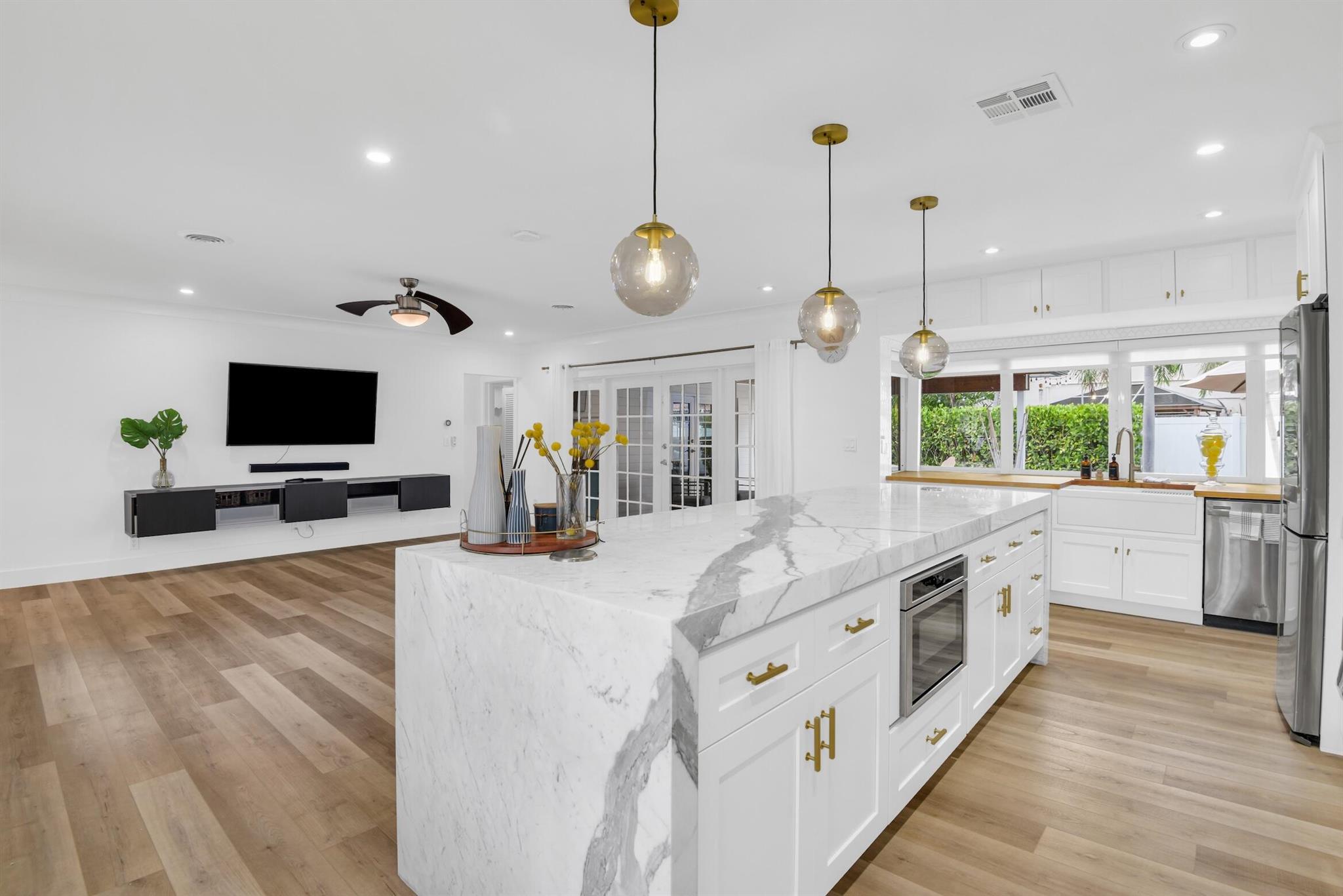 A must-see Boca Bungalow available now!Nestled in the highly sought-after waterfront community of Boca Harbour, this stunning 3-bedroom, 2-bathroom Boca Bungalow is available for an annual lease at $7,500/month or a seasonal lease at $10,500/month. Set on a spacious 1/4-acre lot, this meticulously updated home offers an open floor plan, featuring marble countertops, stainless steel appliances, and seamless indoor/outdoor living.The perfect home for entertaining, enjoy the outdoor bar top by the kitchen passthrough window, or relax by the firepit and unwind under the stars. A 28-foot dock space is conveniently available next door, ideal for boating enthusiasts. The property also boasts ample driveway parking, a fully fenced boat parking area, and a 1-car garage.