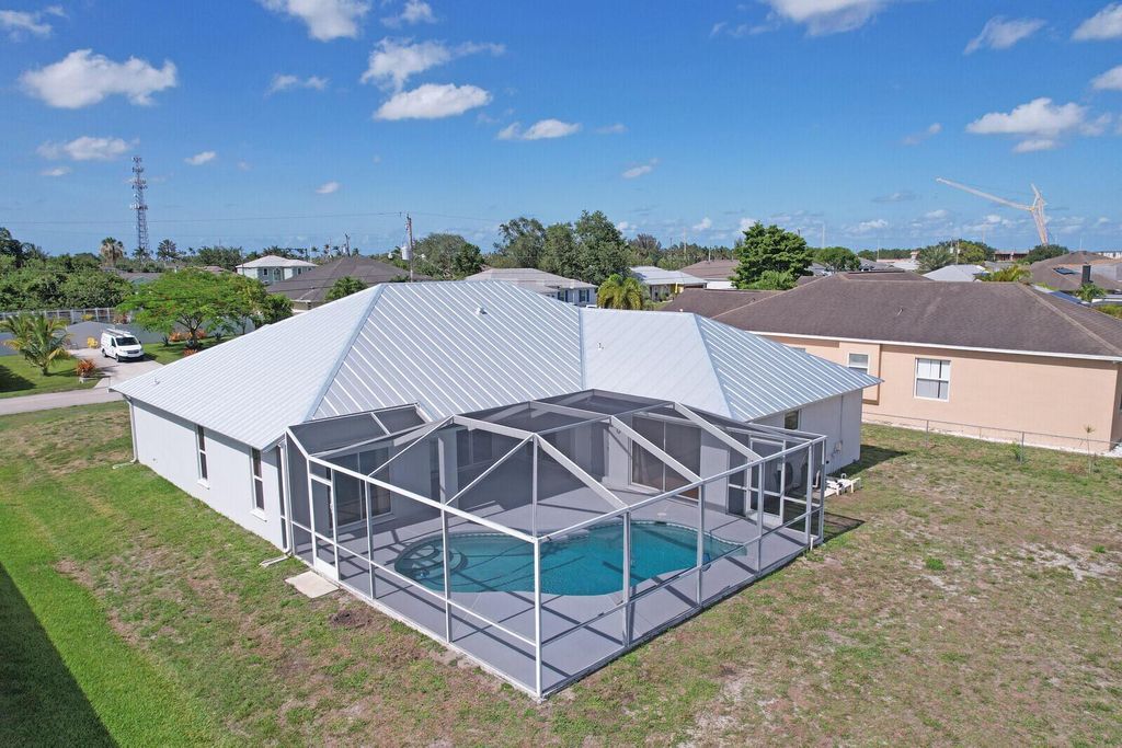 Photo of 516 SW Bradshaw Circle, Port Saint Lucie, FL 34953 (MLS # R10993420)