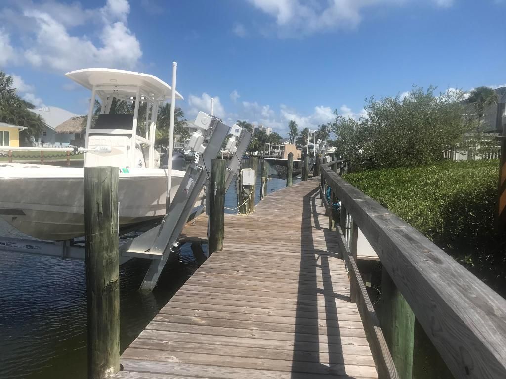 Photo of 2476 Harbour Cove Drive, Hutchinson Island, FL 34949 (MLS # R10905109)
