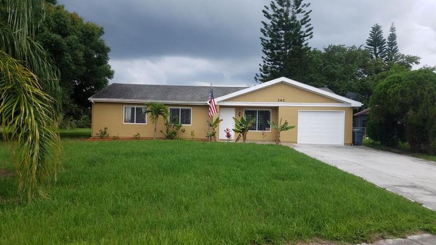 Charming single-family home in an oversized corner lot that backs up to city owned land providing tons of privacy.  Large kitchen with island; tile in the living areas; remodeled baths; BRAND NEW AC and an open concept layout.