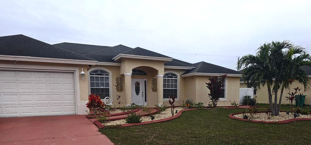 Photo of 562 SW Nadell Avenue, Port Saint Lucie, FL 34953 (MLS # R10949215)