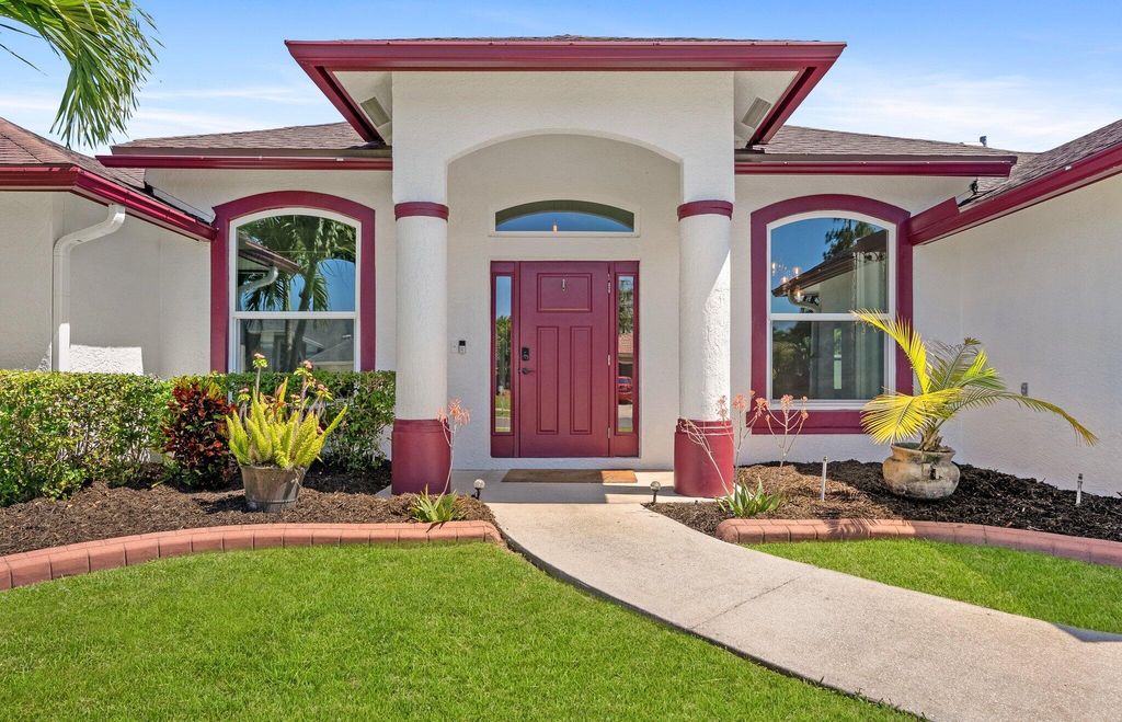 Photo of 107 Sycamore Drive, Royal Palm Beach, FL 33411 (MLS # B26027110)
