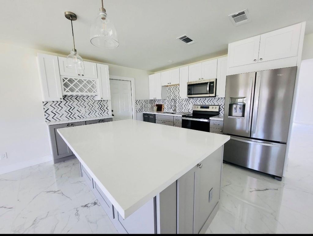 Photo of 469 SW Duval Avenue, Port Saint Lucie, FL 34983 (MLS # F10489794)