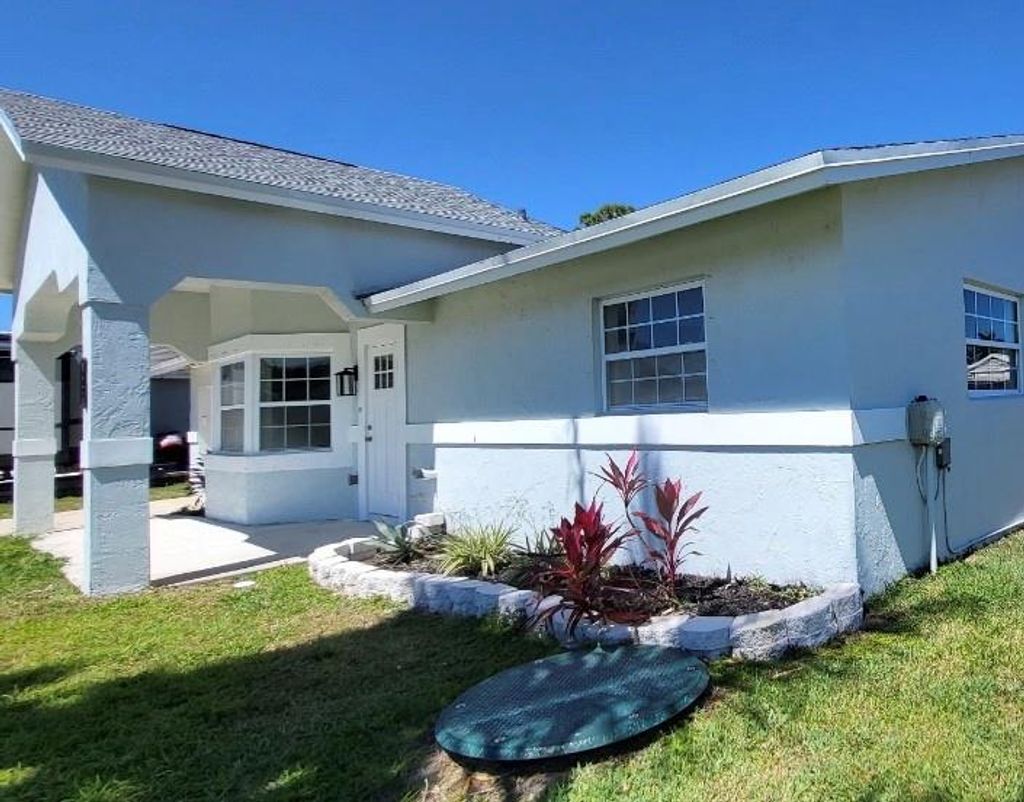 Photo of 469 SW Duval Avenue, Port Saint Lucie, FL 34983 (MLS # F10489794)