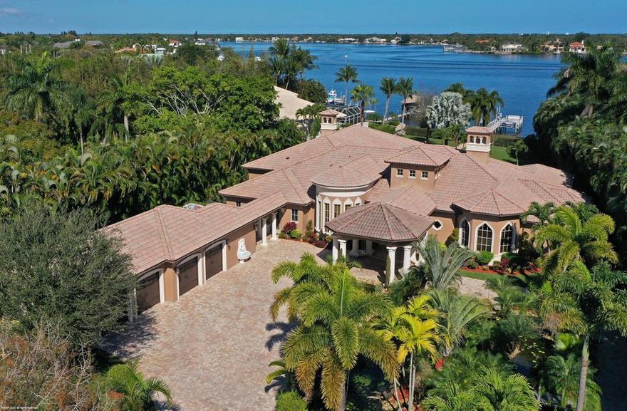 Absolutely stunning riverfront estate on 1.7 acres with spectacular river views in prestigious Pennock Point! Built by Neandross Builders, this truly one-of-a-kind estate features 4 bedrooms+office, 4 full baths, 2 half baths & 4-car garage. Features: Porte Cochere entry; stone & hardwood floors throughout; formal living room w/ custom, beamed ceiling, wet bar & Carolina stone fireplace; formal dining room w/ dome ceilings & built-ins; chef's kitchen w/ prep island, custom cabinetry, granite counters & top-of-the-line appliances; and, a spacious family room w/ double-sided fireplace shared w/ a large game room. The master suite offers custom ceiling, large walk-in closet & elegant bathroom. Exterior features include spacious, covered patio w/ summer kitchen, pool w/ spa, pond w/ waterfalls