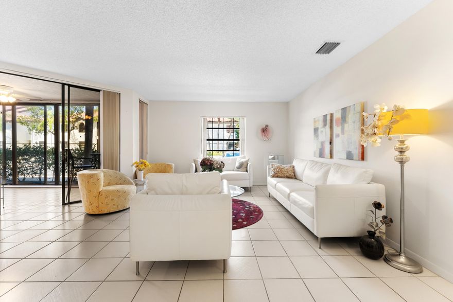 Welcome to this bright and spacious 3-bedroom, 2-bathroom home located in the desirable Carrara Village within Platina Community in Boynton Beach. Filled with natural light, this home features a thoughtfully designed split-bedroom floor plan that offers both privacy and functionality.  The oversized kitchen provides ample space for cooking, entertaining, and everyday living, while the spacious enclosed patio creates the perfect setting to relax, unwind, or enjoy indoor-outdoor living year-round. Hurricane impact windows offer added peace of mind and energy efficiency.  Lovingly maintained, this home presents a fantastic opportunity for a buyer to move right in or customize to their personal style and vision.  Residents of Platina enjoy access to a gated, amenity-rich community  featuring a clubhouse, resort-style pool, fitness center, tennis courts, walking paths, and a full calendar of social activities—perfect for an active and connected lifestyle.  Ideally located just minutes from shopping, dining, and everyday conveniences, you'll be close to destinations like Boynton Beach Mall, local restaurants, and only a short drive to the beautiful South Florida beaches.