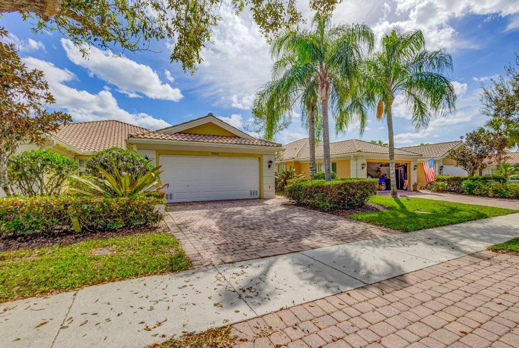 Photo of 5063 Magnolia Bay Circle, Palm Beach Gardens, FL 33418 (MLS # R10969415)