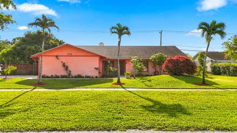 Photo of 3768 Pinehurst Drive, Lake Worth, FL 33467 (MLS # B26053866)