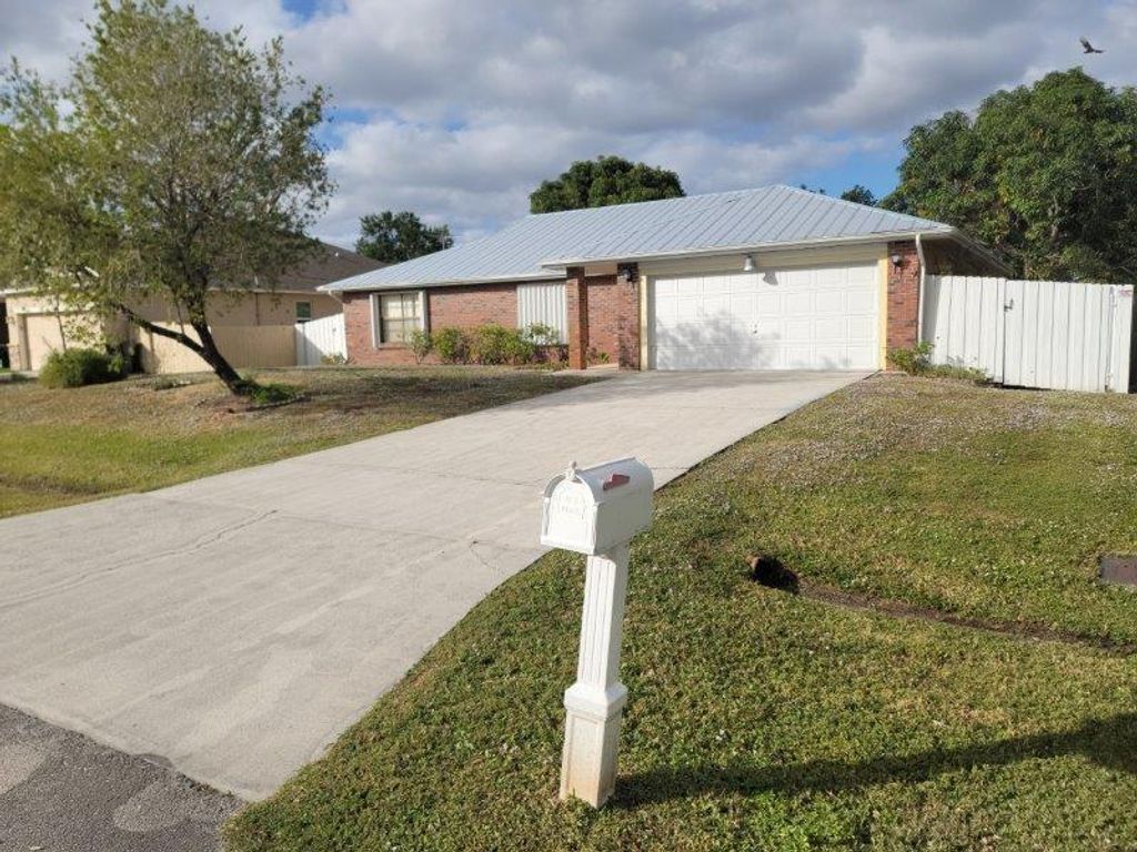 Photo of 545 NW Avon Avenue, Port Saint Lucie, FL 34983 (MLS # R11045865)