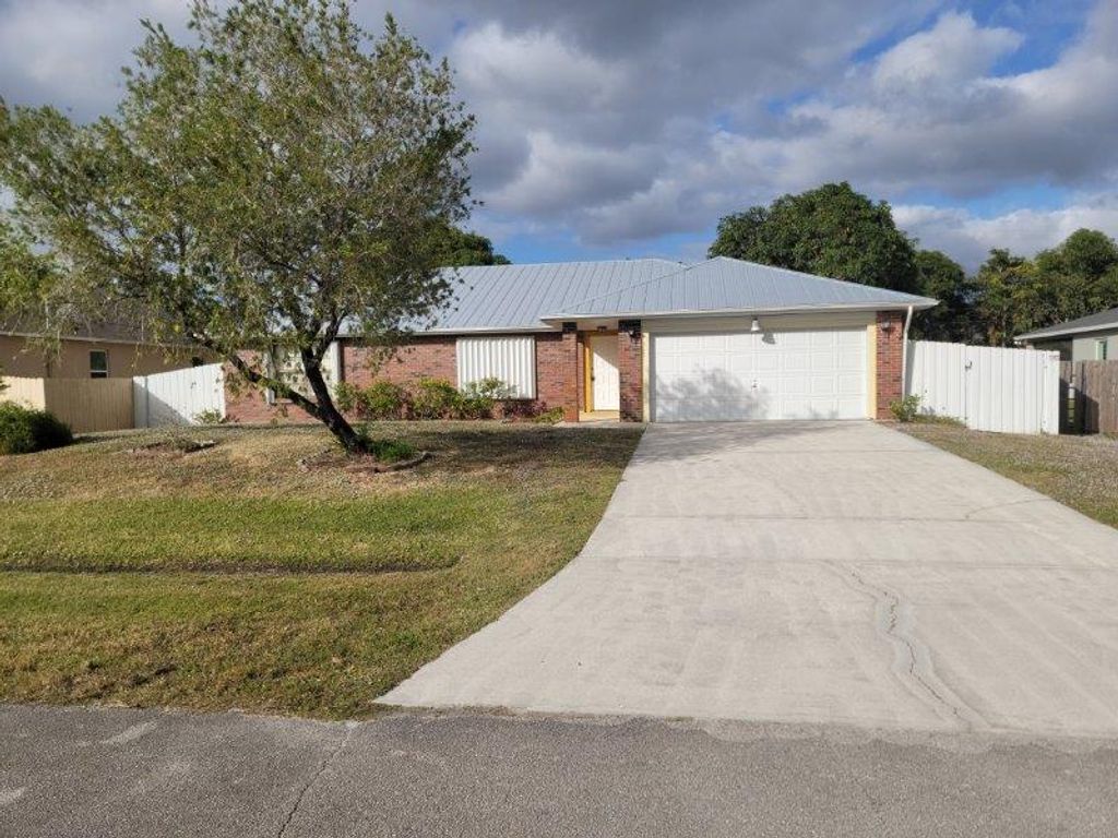 Photo of 545 NW Avon Avenue, Port Saint Lucie, FL 34983 (MLS # R11045865)
