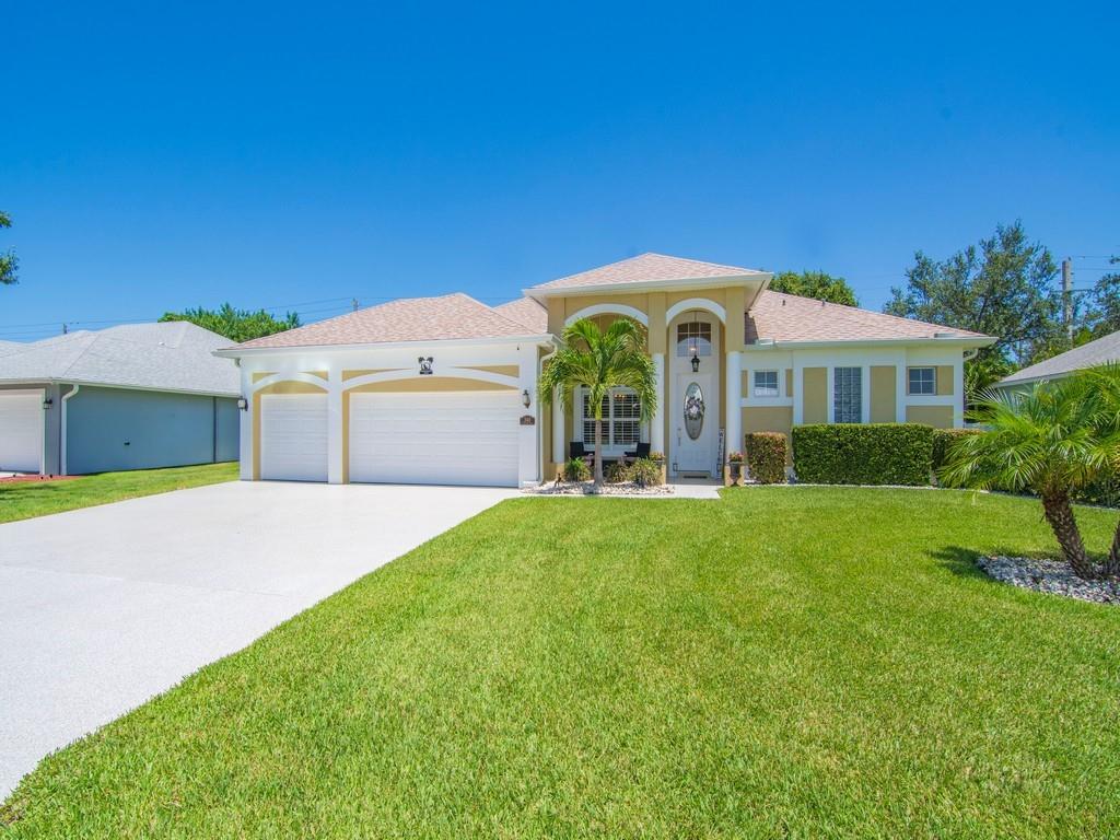 Stunning home in a gated community with 4-bedrooms, 3-baths, 3-car garage pool home featuring a screened-in saltwater heated pool/spa with travertine tile. Interior boasts modern white kitchen cabinets, granite counters, stainless steel appliances, tray ceilings, french doors, luxury vinyl plank flooring throughout. Recent upgrades include new roof, repiping, epoxy-coated driveway/walkway, and freshly painted exterior. Large fenced in backyard offers plenty of space for outdoor living. Meticulously maintained and a must-see! Conveniently located near shopping, dining, and beautiful beaches.