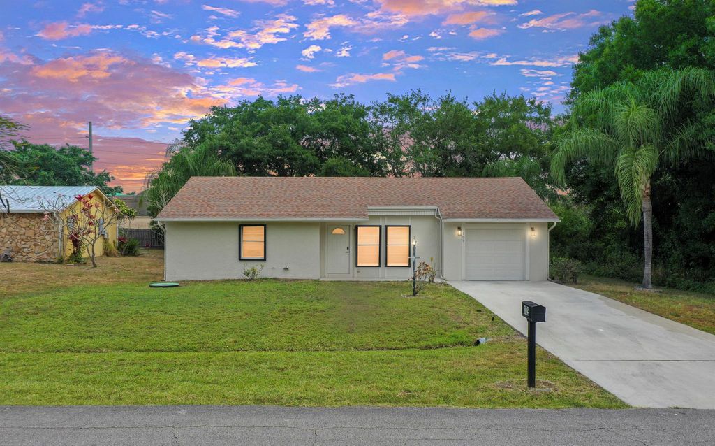 Photo of 109 SW Essex Drive, Port Saint Lucie, FL 34984 (MLS # R10978664)