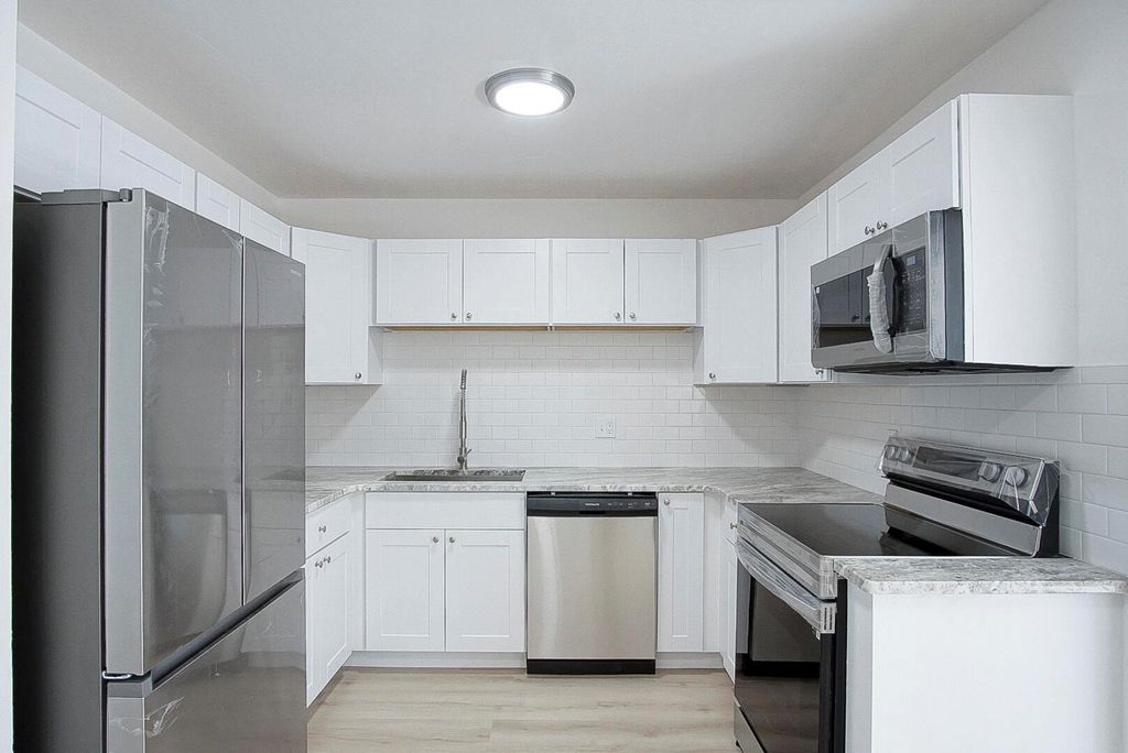 Photo of 109 SW Essex Drive, Port Saint Lucie, FL 34984 (MLS # R10978664)