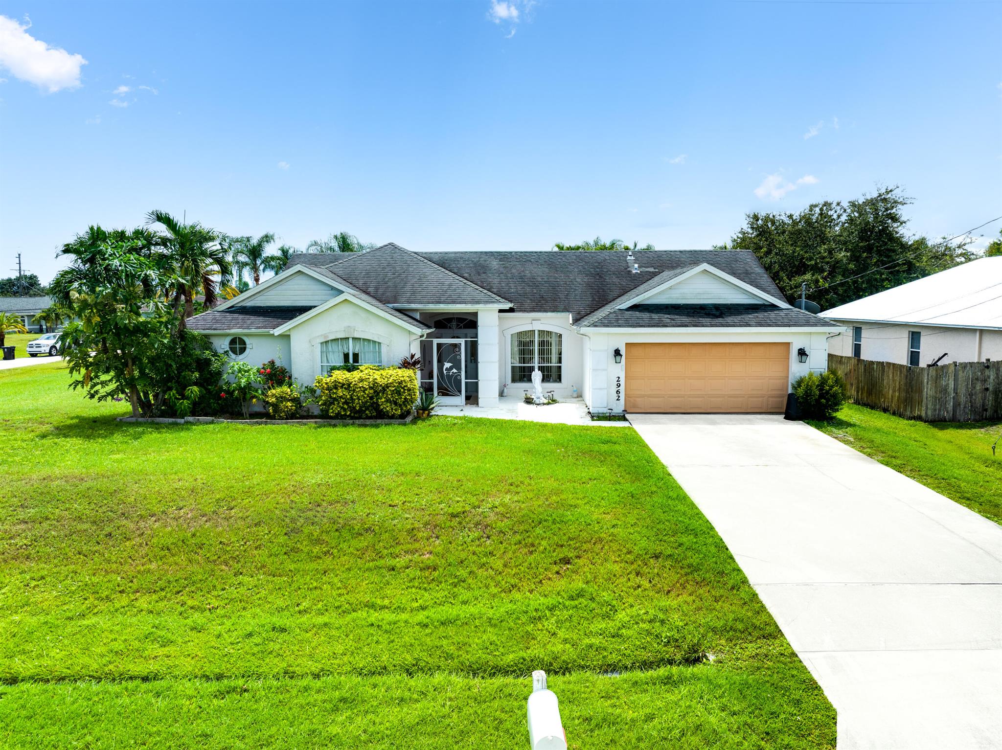 Spacious CBS pool home with NO HOA! Oversized corner lot in the heart of Port Saint Lucie. Plenty of privacy in this home with a unique floor plan offering 4 oversized bedrooms, 2 bathrooms and many custom design details throughout. Upon entry there's a formal living and dining area, with the master suite and one guest bedroom off to the left side. Vaulted ceilings and tile flooring throughout the home. The kitchen has been remodeled with white cabinets, stainless appliances, granite counters and a tile backsplash. Spacious walk in pantry and breakfast bar with room for stools. Next to the kitchen there's a nook for a breakfast table and a door to the outdoor patio and pool. Windows throughout allow plenty of light inside and offer views of the pool from almost every room.