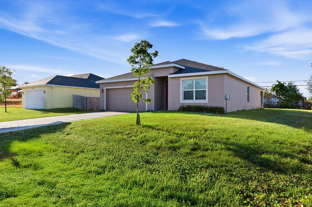 Photo of 1314 SW Goodman Ave, Port Saint Lucie, FL 34953 (MLS # B26000467)