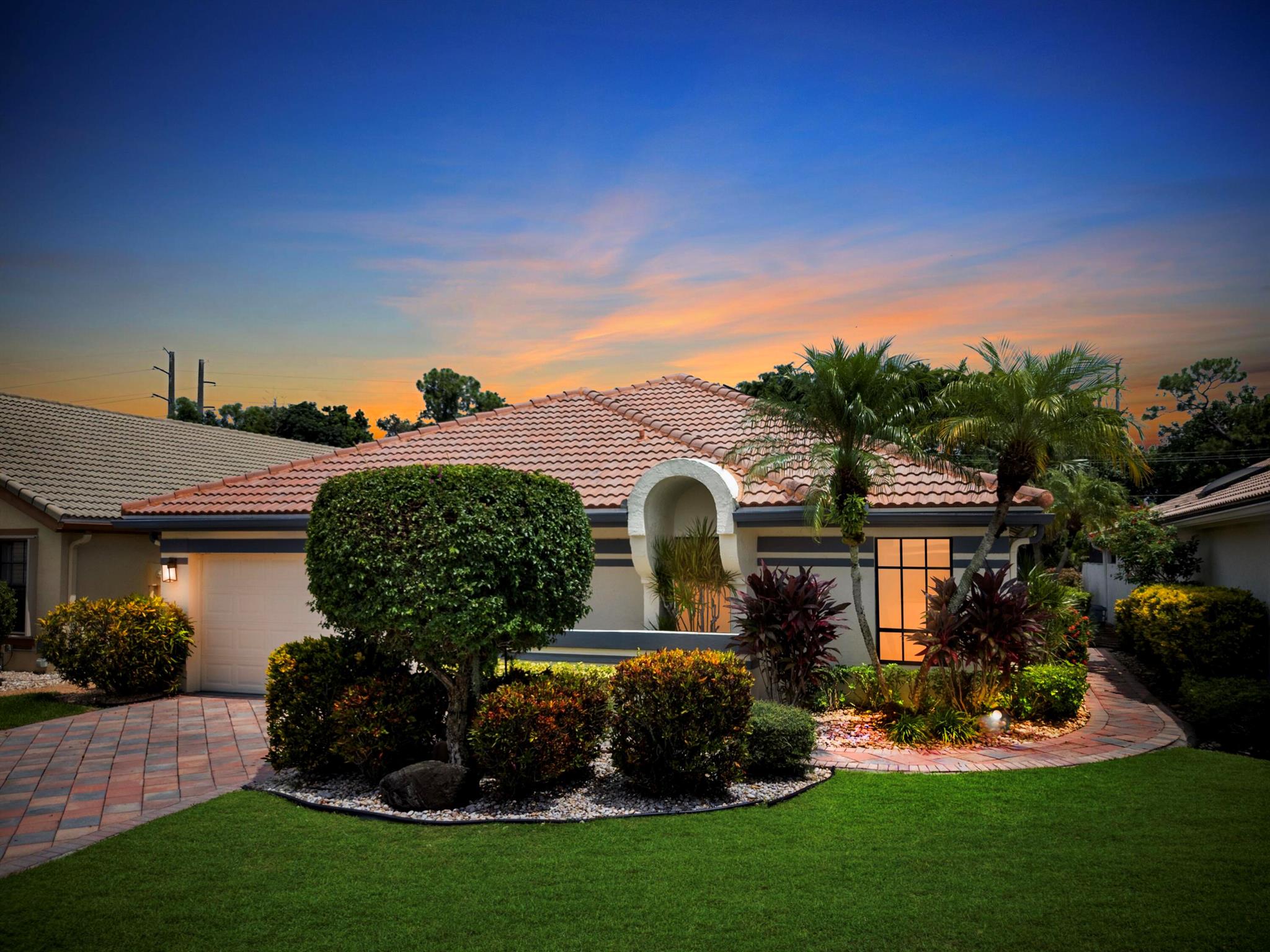 Enjoy the Boca Woods lifestyle in this beautiful Pinewood model, perfectly situated on a private cul-de-sac. This spacious single level home features 3 bedrooms, 2 full baths, a screened patio, pool, and a 2-car garage. The open floor plan offers plenty of room to entertain, while the primary suite includes a walk-in closet, large bath, and serene pool and golf course views. It has solar panels for added efficiency and AC has recently been replaced. Mandatory Golf Membership must be purchased 10 days prior to closing ($120,000). 2 championship 18 hole golf courses, Tennis Courts, Pool, Pickle ball, Gym and Spa plus valet parking along with fine dining and more.LOWEST-PRICED POOL HOME AVAILABLE IN BOCA WOODS! DON'T MISS THIS OPPORTUNITY!