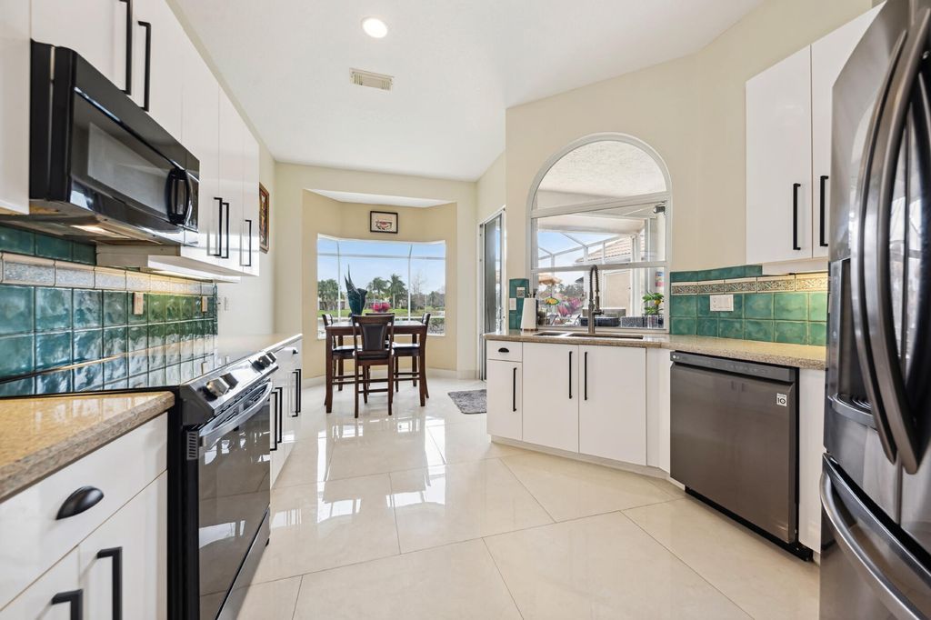 Photo of 721 SW Aruba Bay, Port Saint Lucie, FL 34986 (MLS # R10953420)