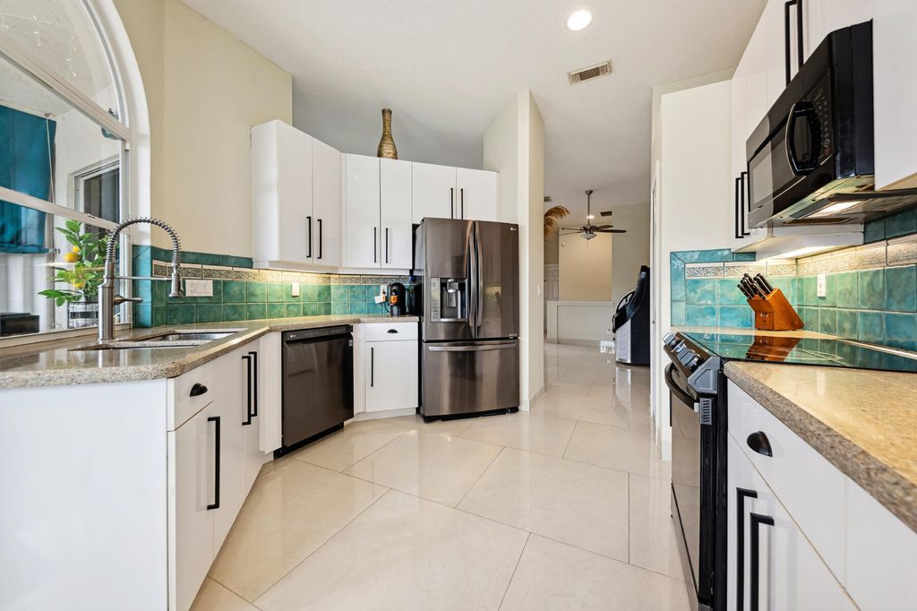 Photo of 721 SW Aruba Bay, Port Saint Lucie, FL 34986 (MLS # R10953420)