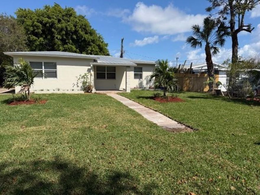 Welcome to this beautifully renovated 3-bedroom, 2-bathroom home located in a safe, quiet neighborhood in the heart of Boynton Beach. Completely remodeled from top to bottom, this move-in-ready property features brand-new flooring throughout, fresh interior paint, and a bright, open living space perfect for modern living.The home offers spacious bedrooms, updated finishes, and a functional layout ideal for families, entertaining, or investment purposes. Step outside to a large private yard with plenty of room to create your own outdoor oasis — add a pool, expand, or simply enjoy the open space. Conveniently located close to beaches, downtown Boynton, shopping, dining, schools, and major highways. A turnkey property in a prime location — perfect as a primary residence, second home, or investment opportunity.