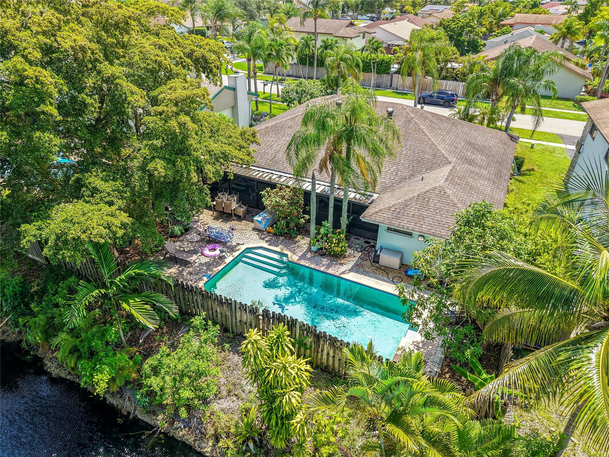 Tropical privacy meets everyday comfort in this 3 bed, 2.5 bath Sunrise home on one of the largest lots and homes in the neighborhood. Features include a 2015 roof, minimal HOA, luxury vinyl flooring, and a quartz kitchen tabletop. Step outside to a private backyard oasis with fruit trees, sweet almond, jasmine, and a butterfly garden. Just 10 minutes from the Stanley Cup Champion Florida Panthers’ arena and close to Welleby Plaza, Sawgrass Mills, and top-rated schools. Spacious layout, quiet street, and move-in ready. Charm, location, and lifestyle all in one.