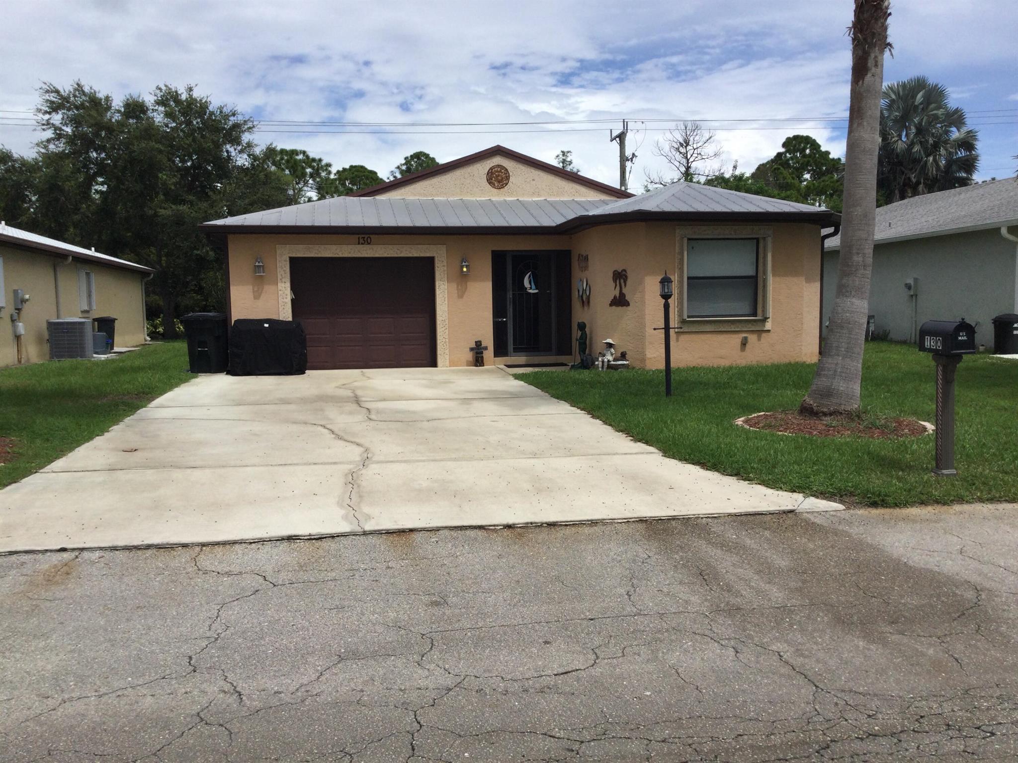 Nicely maintained concrete block home in the much sought after Spanish Lakes Community. This home backs to the canal for privacy. Land lease covers all amenities, lawn care and trash removal. Amenities include 9 hole golf course, 2 pools (1 heated), tennis, pickleball, bocce, horseshoes, shuffleboard, billiards, exercise center, clubhouse, party room, library, game room, dog park and much much more. Do as much as you like or just sit by the pool and relax.