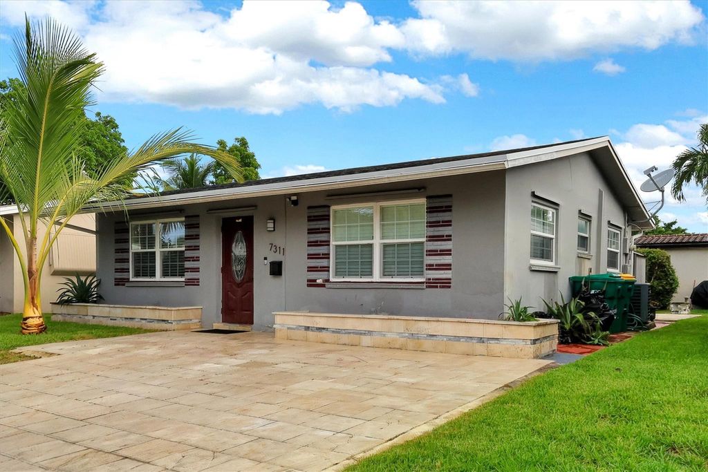 Photo of 7311 NW 57th Court, Tamarac, FL 33321 (MLS # F10514453)