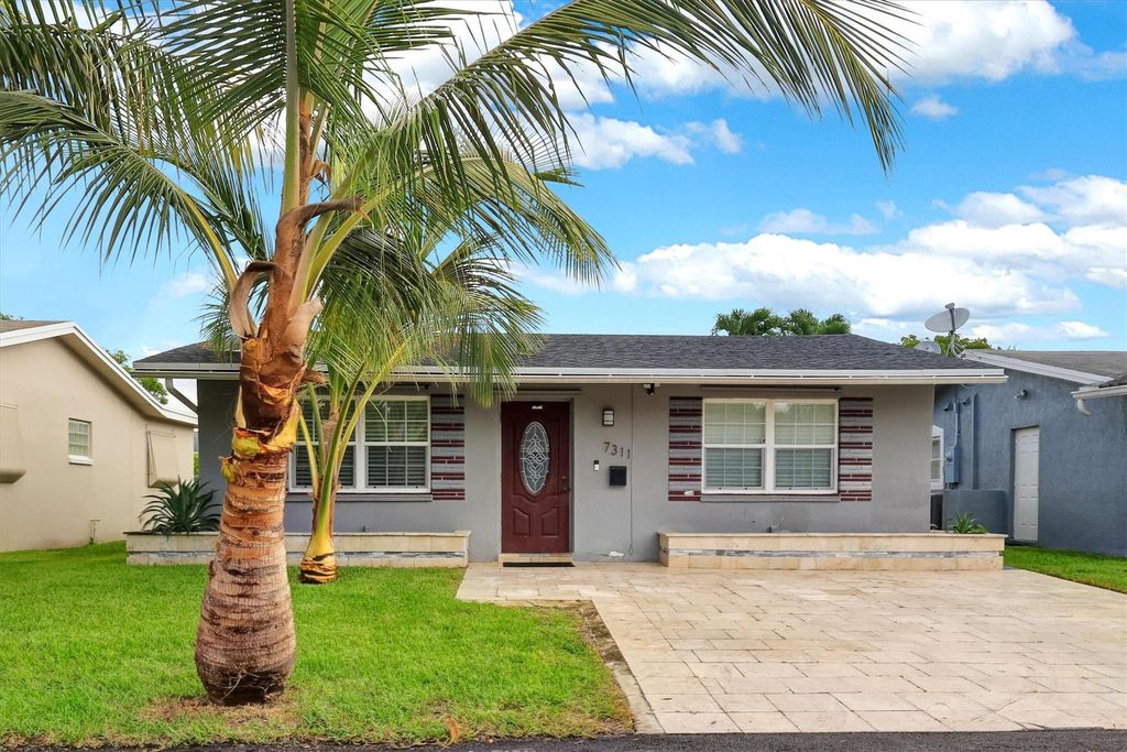 Photo of 7311 NW 57th Court, Tamarac, FL 33321 (MLS # F10514453)