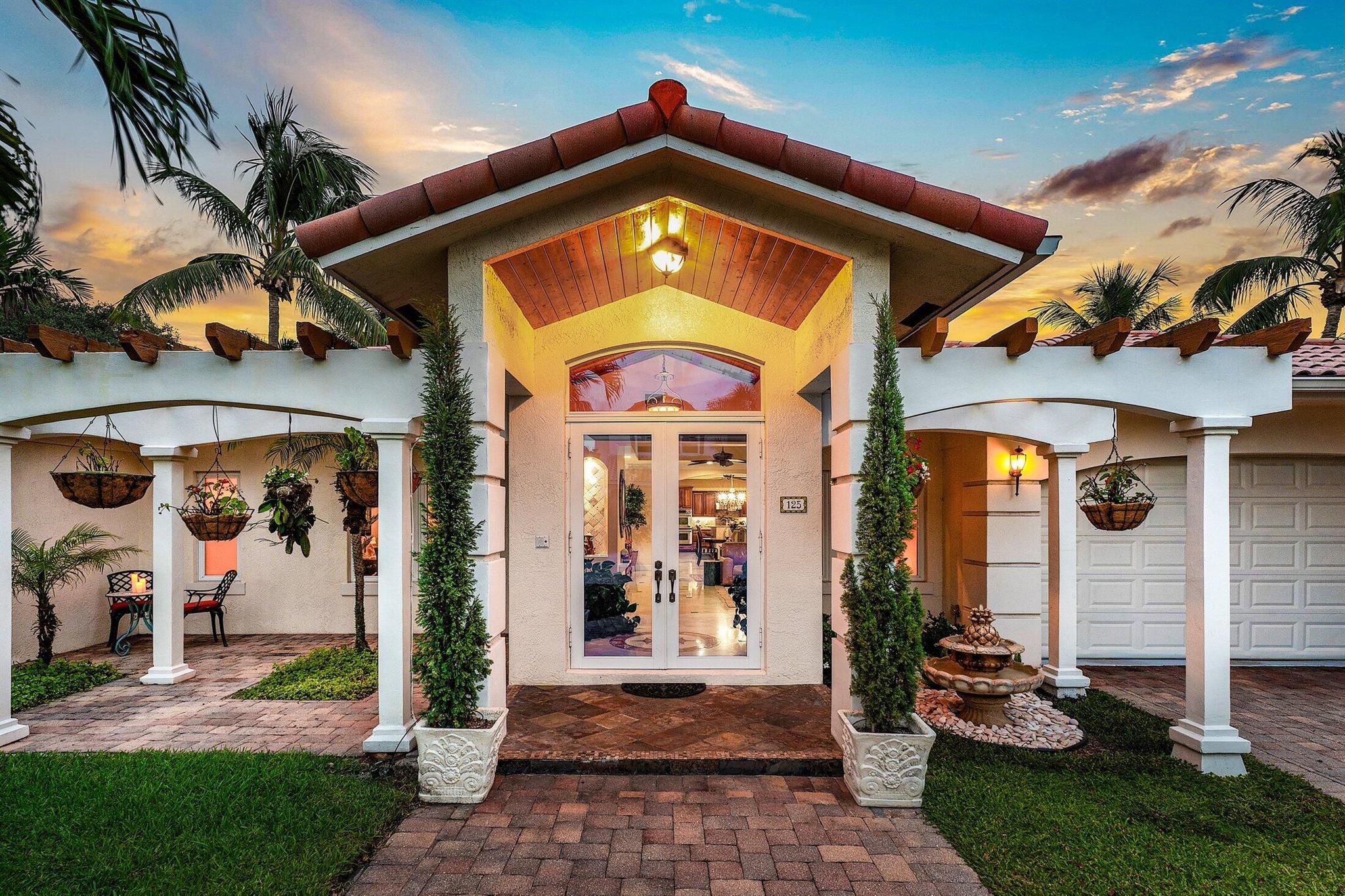 Exquisite 3BR/3BA custom home designed by a renowned local architect and built by its engineer-owner. Offering 2,206 SF under air (2,936 total) on a .21-acre lot, this property boasts PGT impact windows and doors, barrel tile roof, Kohler whole-house generator, two newer AC units with UV lighting, and no HOA.Interior highlights include 10-12 ft ceilings, 24x24 travertine floors, crown molding, coffered and tray ceilings, solid core doors, bar with wine cooler, central vac, and cedar-lined closets. The gourmet kitchen features granite counters, cherry cabinetry, professional 6-burner Jenn Air gas cooktop with pot filler, dual convection ovens, and pantry with pull-outs.The luxurious primary suite offers French doors to the pool, a spa bath with onyx vanities, Jacuzzi tub,