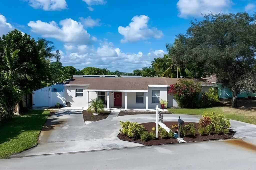 Photo of 6941 Boston Drive, Atlantis, FL 33462 (MLS # B26032443)
