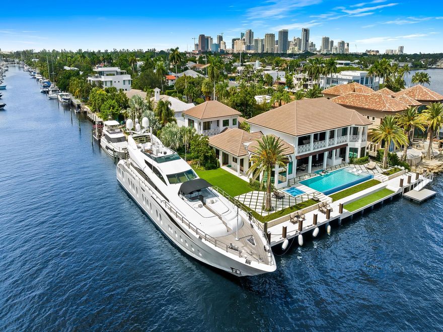 Live the true "South Florida Lifestyle" on this island's gated West Indies Oasis! Just Completed and offered fully designer finished and furnished! Be the 1st to enjoy! Main residence boasts 20' ceilings and panoramic waterviews upon entry with dramatic half-moon staircase. Media room with octagonal vaulted ceilings. Cozy bar & wine room. Chef's kitchen featuring La'Corneu gas range and massive center island. Private Owner's Suite with custom closet/dressing area & designer spa-bath. Private Guest House with 2BR/2BA.  Enjoy outdoor living from either 1st or 2nd level lanais overlooking resort-style Infinty pool/spa/sun-shelf & wide Intracoastal Waterway.  Protected canal dockage up to 152'± & 140'± on ICW. From dock to Atlantic through Port Everglades -10 minutes!!