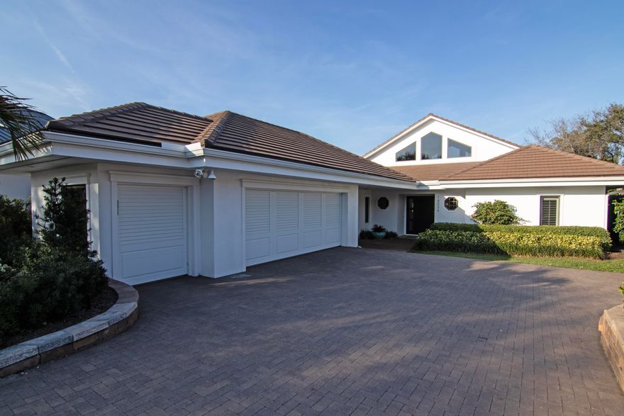 Upscale single-story estate located on the 16th hole of prestigious Jupiter Hills with sweeping fairway views. Fully renovated to the studs in 2015 by Ed Knight Contracting, this meticulously maintained residence offers exceptional quality and craftsmanship throughout. Featuring 3 spacious bedroom suites & 3.5 baths, the home is designed for comfort and privacy. The chef's kitchen by Waterview Kitchens includes custom cabinetry, premium finishes, high-end appliances, and a large center island, all opening to expansive living and dining areas ideal for entertaining. Designer interiors by Patrick Day Interiors showcase wood flooring, marble accents, soaring ceilings, and abundant natural light. Large windows frame beautiful golf course views. Seamless indoor-outdoor living enhances the home's appeal, offering inviting spaces for both relaxation and entertaining. Move-in ready and impeccably cared for, this property presents a rare opportunity within one of South Florida's most sought-after private golf communities. Golf membership is separate and does not convey with sale. Call now for a private showing!