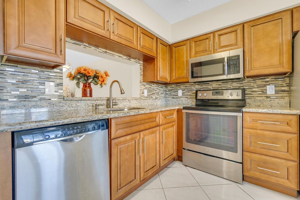 Photo of 7290 Kinghurst Drive #406, Delray Beach, FL 33446 (MLS # R11134767)