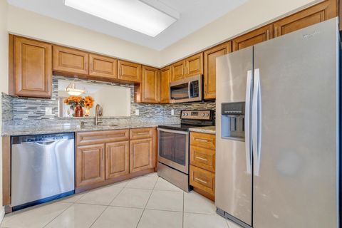 Photo of 7290 Kinghurst Drive #406, Delray Beach, FL 33446 (MLS # R11134767)