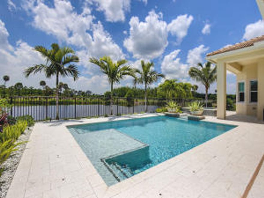 Beautiful & modern 4 BR/den/loft lakefront home, built 2014, move-in ready! Very private w/lake, golf, & preserve views, beautiful sunsets. $50,000 electronic system (incl iPort surround sound), diagonal marble floors, volume ceilings, crown molding, clerestory windows, electric blinds, LED high hats (less heat, lasts longer). Bright & open, split floor plan, granite chef's kitchen has large island & 6 burner gas range. Granite wet bar, den w/custom built-ins, marble cabana bath. Spacious coral stone patios, heated pool w/sun deck & spa, granite summer kitchen, panoramic views, fenced yard. Gas line for fire pit. Northern County's newest country club w/luxury amenities, low membership fees! Great proximity to cultural venues, world class shopping, fine dining, beaches, A rated schools