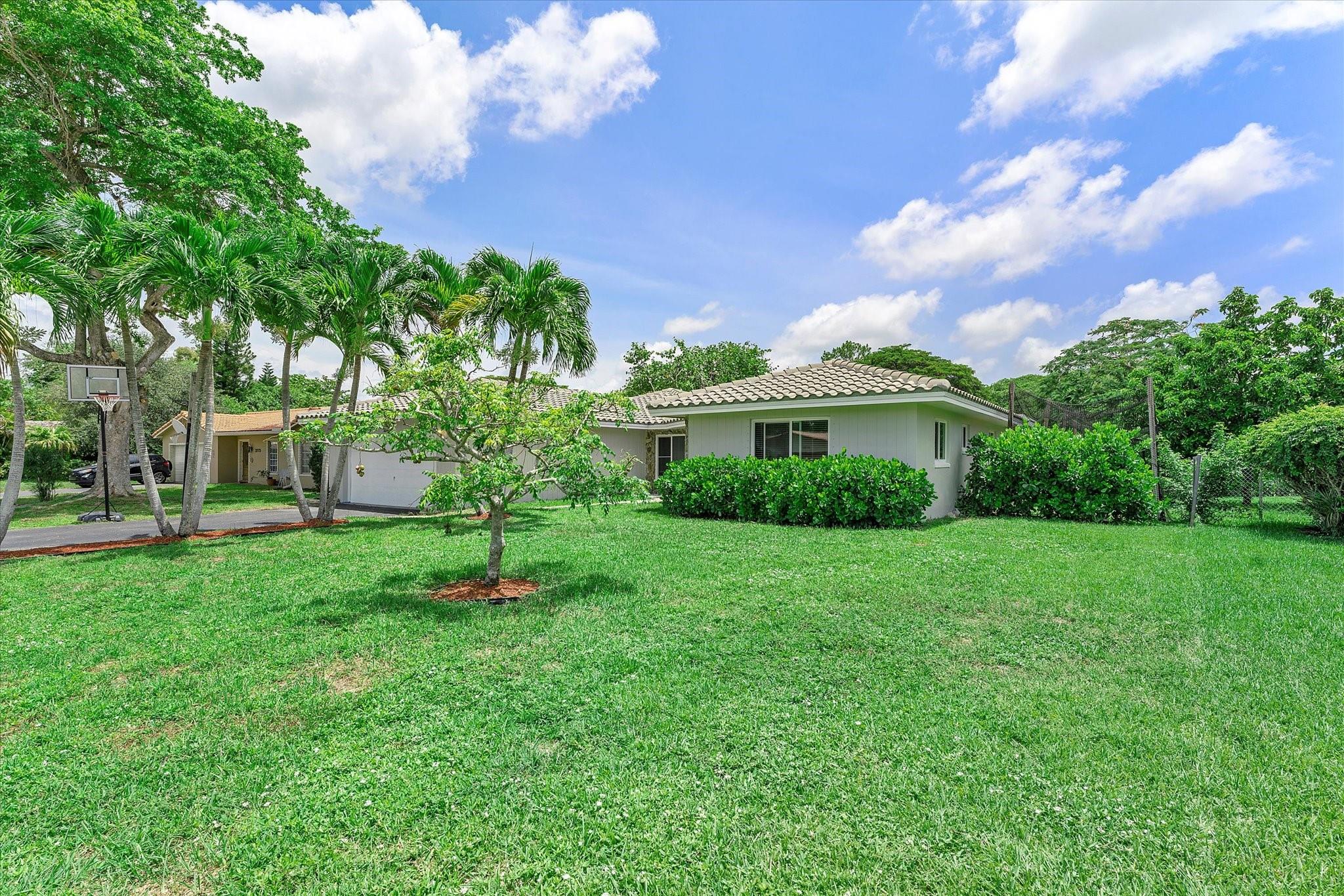 PRICED TO SELL. NO HOA! BUILT IN EQUITY OVER $100K. Seller paid off all home improvement loans. Beautiful double door entrance with updated 3 bedrooms/2 bath home. 2,034 sq ft under air with 2,293 total sq ft. LARGE MASTER with walk in closet and ensuite. KITCHEN AND BATHROOMS REMODELED. TILE FLOORING throughout with eloquent WOOD FLOORING in bedrooms.
Spacious LOT over 10,000 sq ft with 2 car garage that wows! There's more- NEW ROOF/ HURRICANE IMPACT WINDOWS/ DOORS. Make this dream home your own!! Location,Location, Loacation! Walk to downtown Coral Springs, The Walk, Barnes & Noble, library, coffee shops, restaurants, boutiques, banks, medical offices, parks and more. Broward College has a campus in the city. Fantastic schools within 2 miles from home