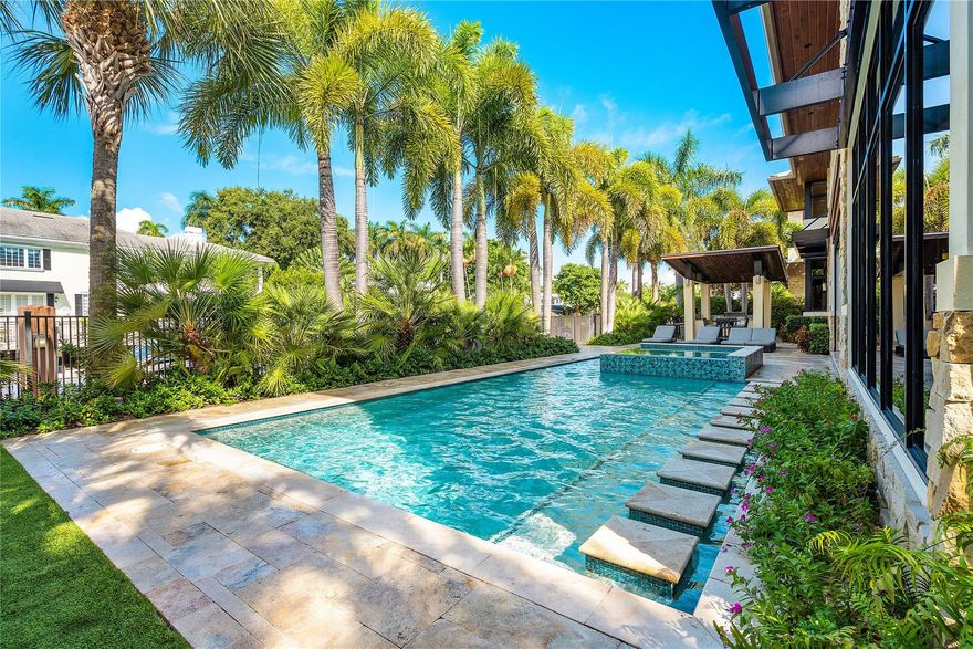 A Blend of Art & Modern Architecture Define this Sophisticated Contemporary Masterpiece. Water, Fire,Stone,Wood,Glass & Metal Elements Blend Together Creating An Unparalleled Standard Living. Highly Sought After South Side of Las Olas Isles on 100ft of Premium Deep Draft Waterfront. Quick Ocean Access w/ No Fixed Bridges. Generous Floor Plan w/ Living & Dining Space Perfect for Indoor & Outdoor Entrainment. Fireplace, Bar & Glass Enclosed Wine Cellar. Resort Style Pool, Office, Generous Sized Bedrooms, In-Law Suite, Huge primary Baths & Closet. Control 4 Home Automation System, 16 Cameras, 4 Car Garage w/ 2 electric charges, Automated Mosquito Control Sysytem,Gated & Secured. Minutes to Fort Lauderdale Airport, World Famous Fort Lauderdale Beach and Las Olas Isles Shopping and Restaurants.