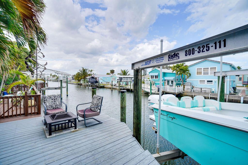 Photo of 26 Aqua Ra Drive, Jensen Beach, FL 34957 (MLS # R10959367)