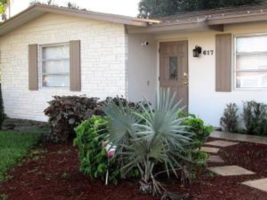 Home on corner lot. 3 beds 2 bath plus den with sitting room. Living Room entry with plantation shutter window treatments and easy to maintain wood flooring extending into the dining area. Access to the screened lanai from Master & Dining area, fenced back yard with private workshop affording extra storage space. The generous sized kitchen, equipped with stainless steel appliances, is light and airy, with ample cabinetry, one could add a convenient portable island or cafe table. The Master bedroom is comfo