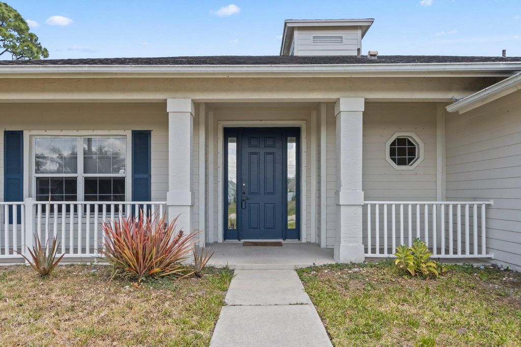 Photo of 1679 SW California Boulevard, Port Saint Lucie, FL 34953 (MLS # R10983455)