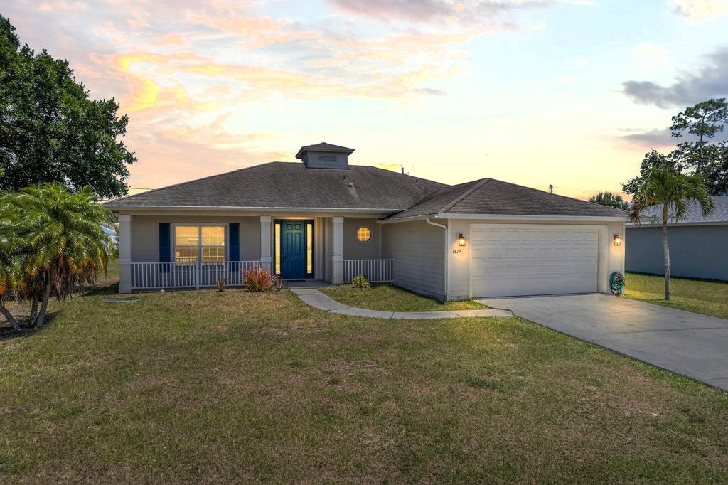 Photo of 1679 SW California Boulevard, Port Saint Lucie, FL 34953 (MLS # R10983455)