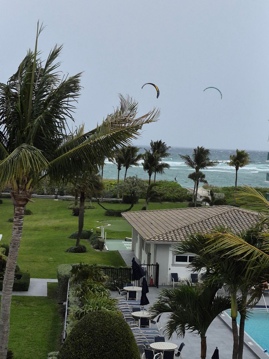 Direct Ocean and Pool View... Spacious Bright Corner 2 bed-2 Bath Unit....Beautiful Tile Floors...Remodeled Baths ... Great heated Pool...Beautiful Beach with private beach access. DESIGNATED CARPORT SPACE right near entry with extra parking available for second car.  Balcony with that ocean view and breeze. Master bedroom has California king.  Enjoy Bocci, Miniature Golf & Shuffle Board or relax in the lounge. Cable TV, WIFI, and Water and are all included. New Flat Screen TV &  Newer Sofas. Immaculate. No Smokers, No pets. Convenient to restaurants and shopping. Available starting April 4-8 months.