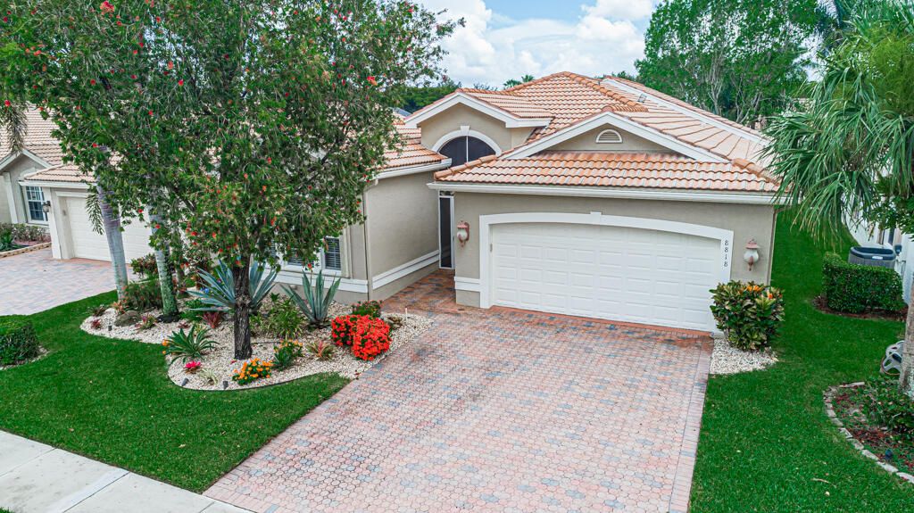 Photo of 8818 Laguna Royale Point Pt, Lake Worth Beach, FL 33467 (MLS # R10813634)