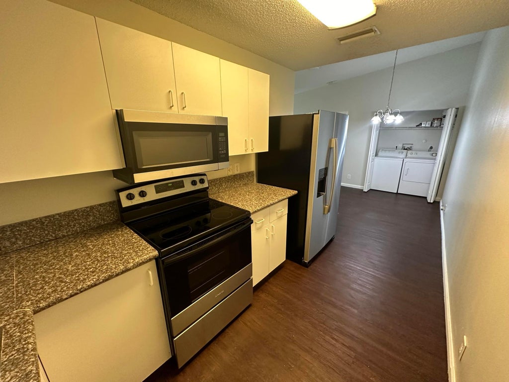 Photo of 5070 Sanctuary Way #B, West Palm Beach, FL 33417 (MLS # B26004551)