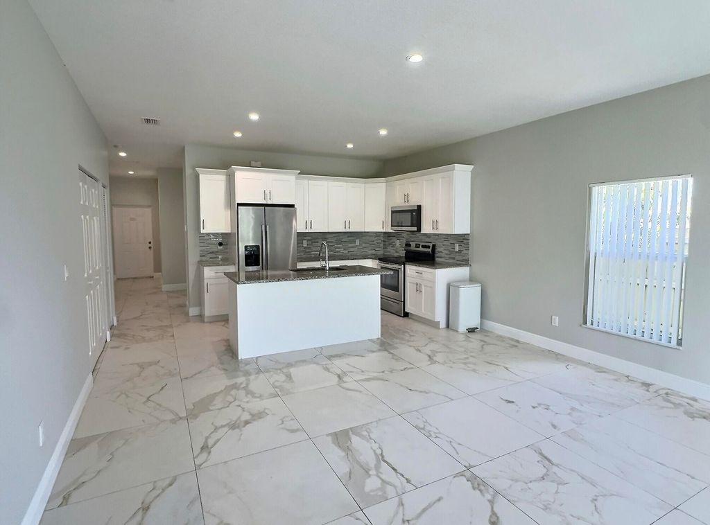 Photo of 413 Martin Avenue, Greenacres, FL 33463 (MLS # B26032009)