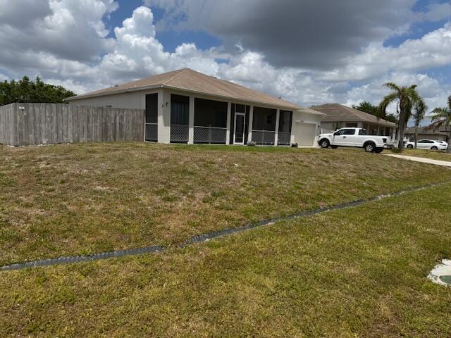 Welcome to wonderful Florida living! Conveniently located near i95 and Fl Turnpike as well as easy access to Tradition/shopping/dinning and close to St. Lucie West and Mets stadium. This great open floor plan house is located on a corner lot with .32 acres, fenced yard for privacy. the house boasts a front screen porch as well as a screened back patio. Features an open spacious layout with 4 Bed, 2 baths, and a split floor plan. wood laminate floors in beds and main living areas. Vinyl flooring in kitchen and bathrooms. Kitchen offers plenty of cabinets for storage. Newer stainless appliances, a spacious island, eat-in breakfast area, and large pantry. Master suite features large walk-in closet and bathroom with separate soaking tub and shower.