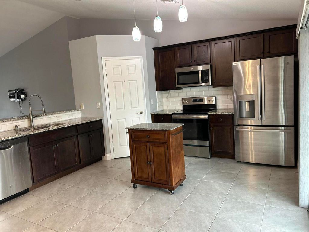 Photo of 1114 SW Bellevue Avenue, Port Saint Lucie, FL 34953 (MLS # B26001044)