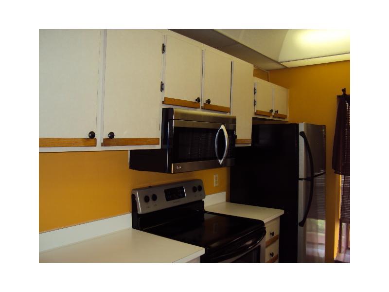VERY SPACIOUS 2/2 WITH A DEN IN POPULAR, PET FRIENDLY MEADOWRIDGE. THIS UNIT IS 1350 SQ FEET, 2ND FLOOR CORNER UNIT WITH VAULTED CEILINGS. NEW TILE THROUGHOUT, SS APPLIANCES, FULL SIZE W/D IN UTILITY ROOM, AND A SCREENED BALCONY WITH WONDERFUL GARDEN VI EWS. UPDATED LIGHT FIXTURES AND 3 CEILING FANS. THIS COMMUNITY HAS A CLUBHOUSE WITH A POOL, HOT TUB, COOK OUT AREA, SECURITY PATROL AND MORE.