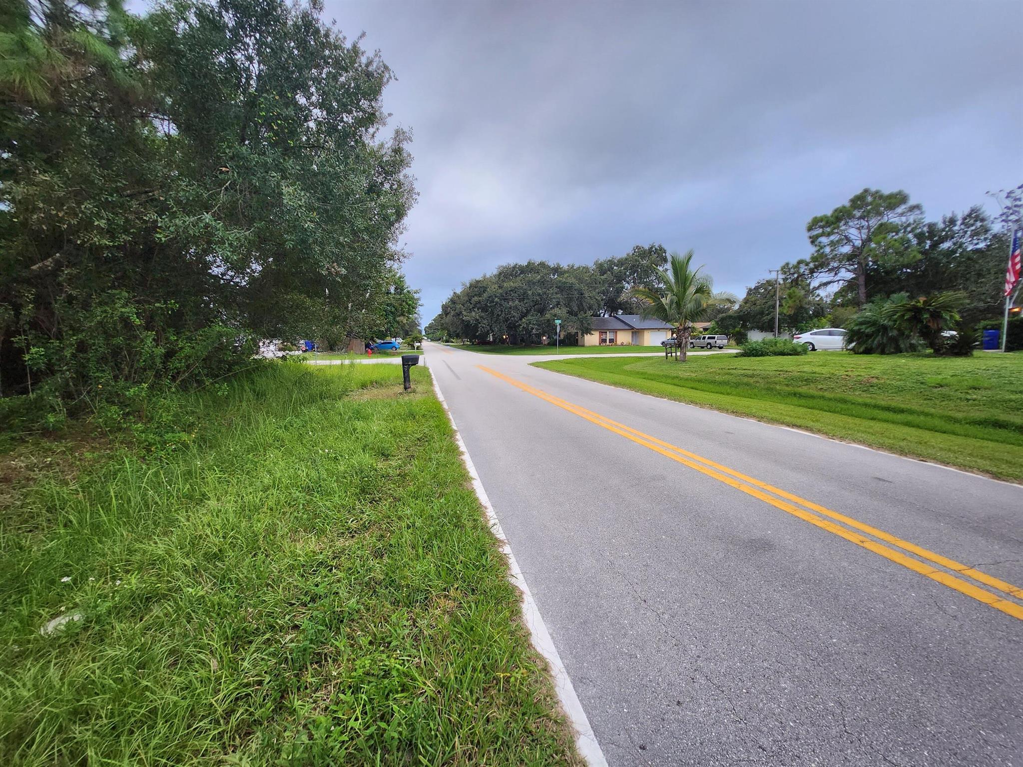 Ready to build your dream home? This 0.25-acre mostly cleared lot on a paved road in the peaceful Paradise Park community offers a blank canvas. this property blends convenience with a laid-back Treasure Coast vibe--20 minutes from Vero's pristine beaches. Surrounded by mature trees along the perimeter, it's got natural privacy and charm without the hassle of heavy clearing. No HOA means freedom to design your space your way. Utilities nearby, high-ground location, and a rare find. this one's primed for your vision!